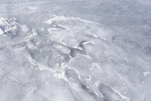 Ice pattern on a frozen surface