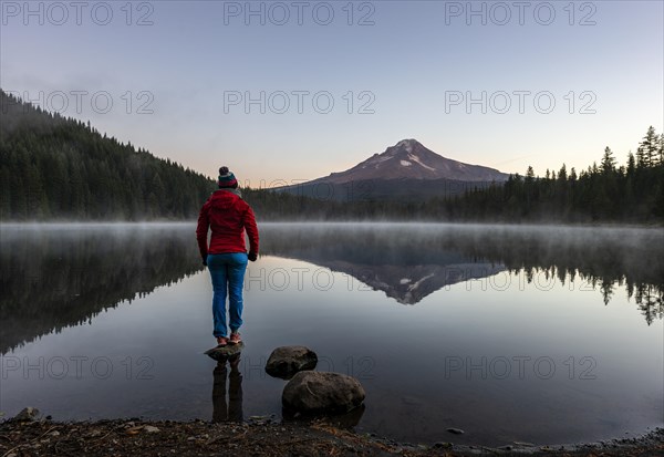 Young woman standing on a stone