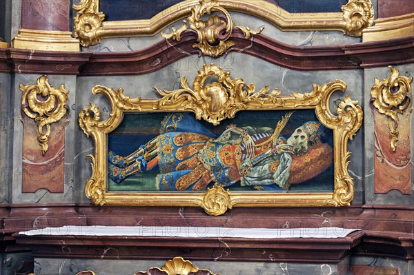 Reliquary of a side altar artfully framed in rocaille frames