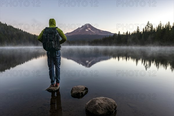 Young man standing on a stone