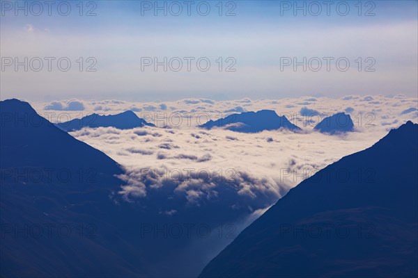 View to the Timmelsjoch High Alpine Road with bad weather front in South Tyrol