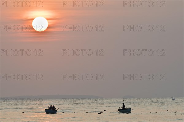 Fishing boats at sunrise