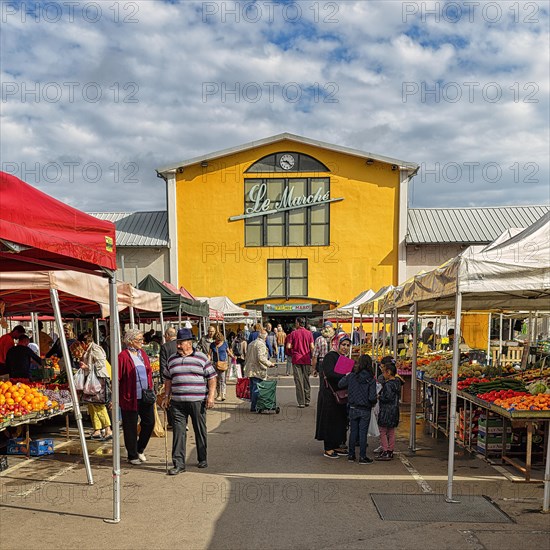 People at a weekly market market