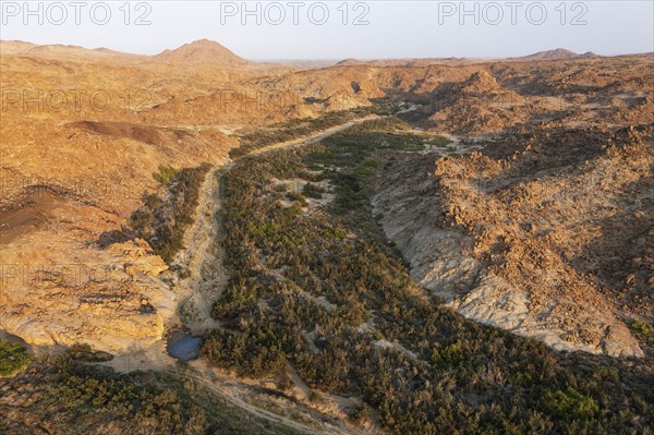 The dry bed of the Ugab river with a little water hole that remained from the last rain