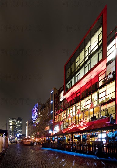 Spielbudenplatz at night with the Schmidt Theatre and the Dancing Towers in the background