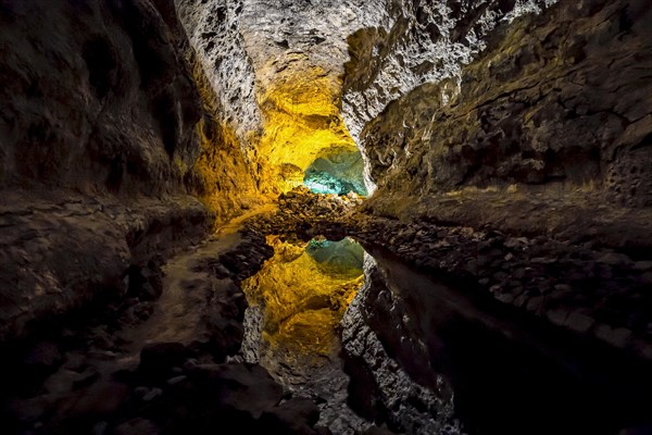 Colourfully illuminated areas of the Cueva de los Verdes