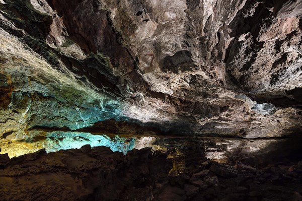 Colourfully illuminated areas of the Cueva de los Verdes