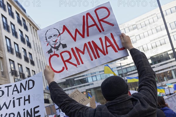 Demonstrator holds protest placard against Russian invasion of Ukraine