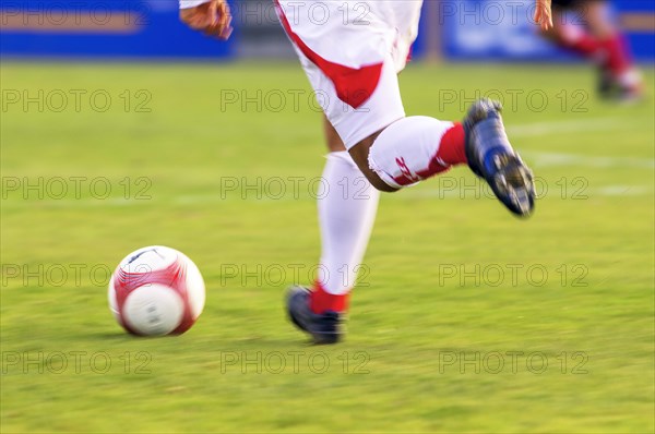 Legs of a running football player