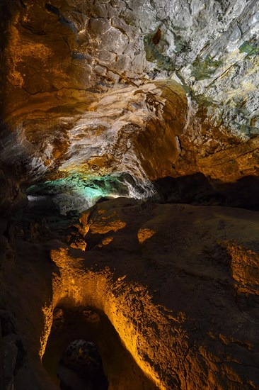 Colourfully illuminated areas of the Cueva de los Verdes