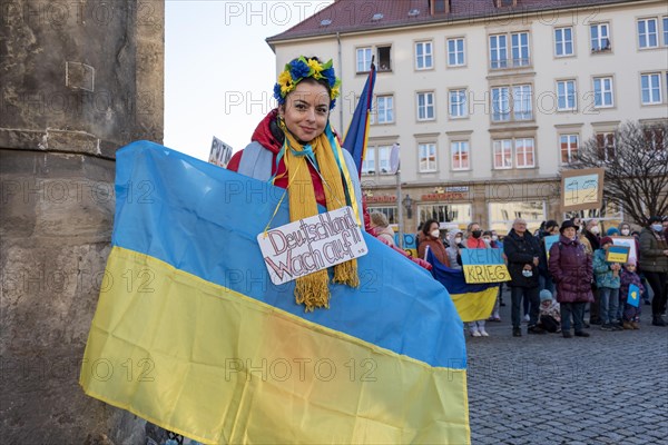 Young woman with Ukrainian flag