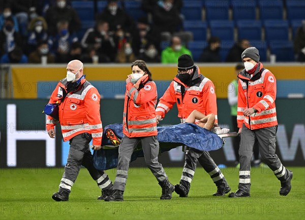 Paramedics carry Dennis Geiger