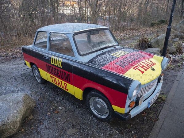 Advertisement for the GDR Museum in Thale on a Trabant in the colours black