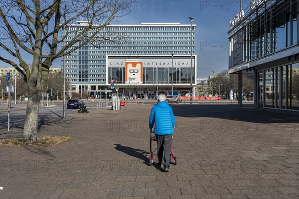 Senior citizen with rollator on the move in the capital