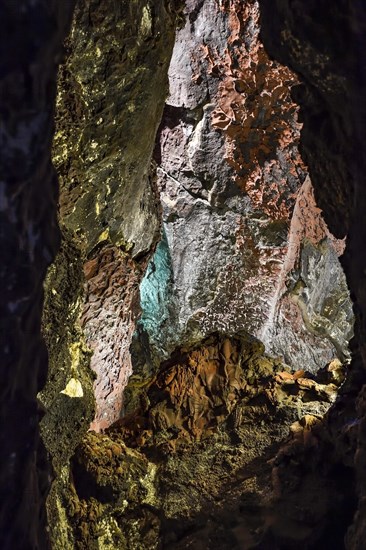 Colourfully illuminated areas of the Cueva de los Verdes