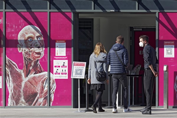 Young visitors enter the exhibition Body Worlds by Gunther von Hagen