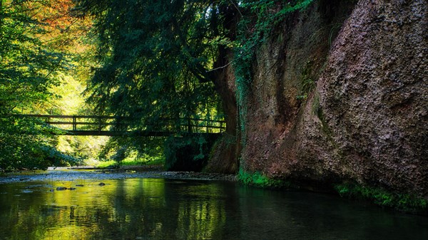 Bridge with river Jona and rock face