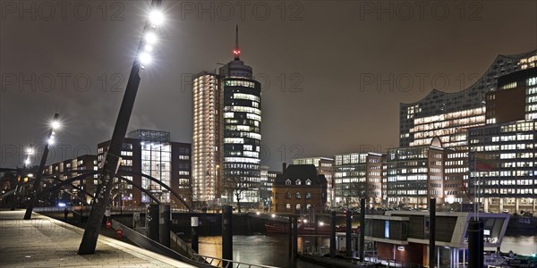 Elbe promenade with Columbus House and the Elbe Philharmonic Hall at night