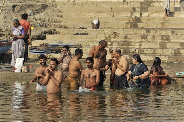Worshippers on the banks of the Ganges during ritual ablutions in Varanasi