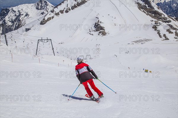 Skier on glacier ski slope Olperer