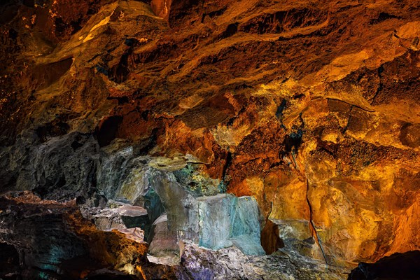 Colourfully illuminated areas of the Cueva de los Verdes