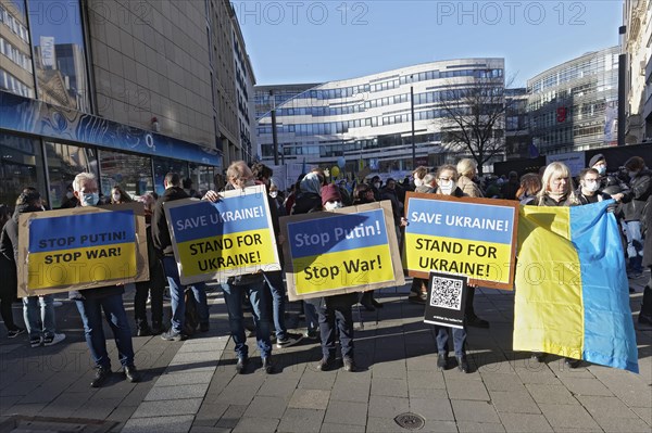 Demonstrators with protest placards against the Russian invasion of Ukraine