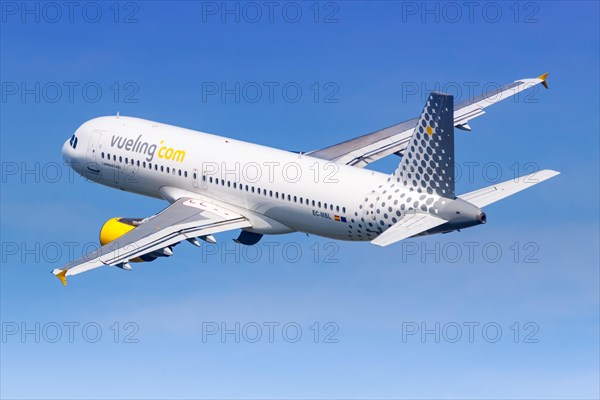 A Vueling Airbus A320 with registration EC-MBL takes off from the airport in Barcelona