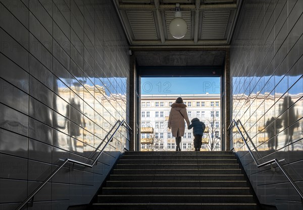 Passengers at the exit of the underground station Straussberger Platz