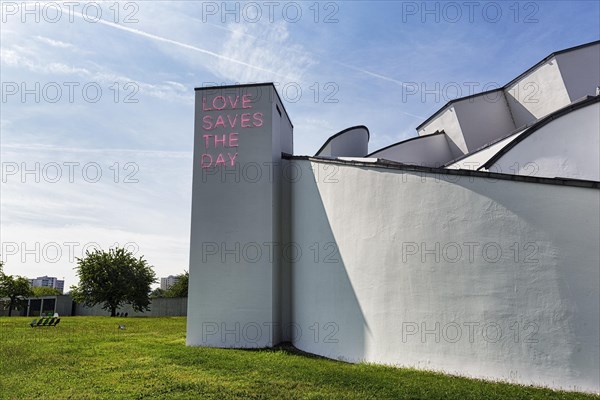 Modern building with illuminated sign