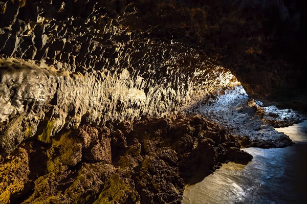 Colourfully illuminated areas of the Cueva de los Verdes