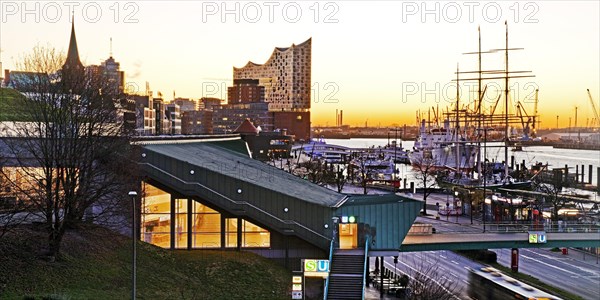 Elbe Philharmonic Hall with the Landungsbruecken underground station at sunrise