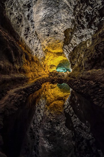 Colourfully illuminated areas of the Cueva de los Verdes