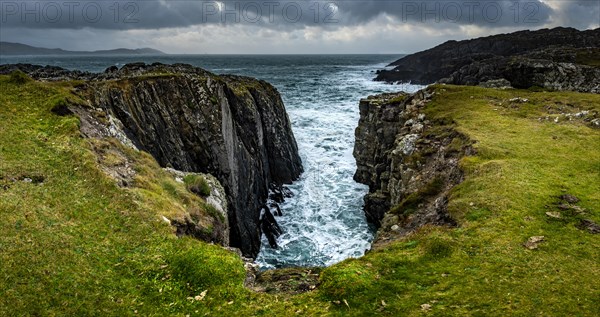 Sea surf on rocky coast