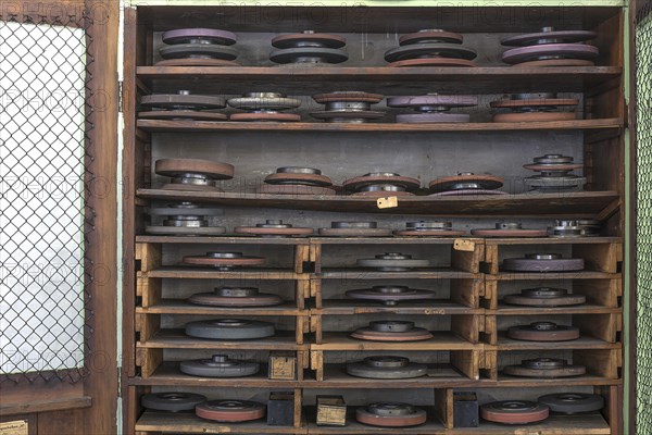 Cupboard with grinding wheels in a historic lathe shop