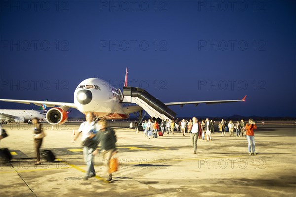 Landed airline with passengers on tarmac at airport