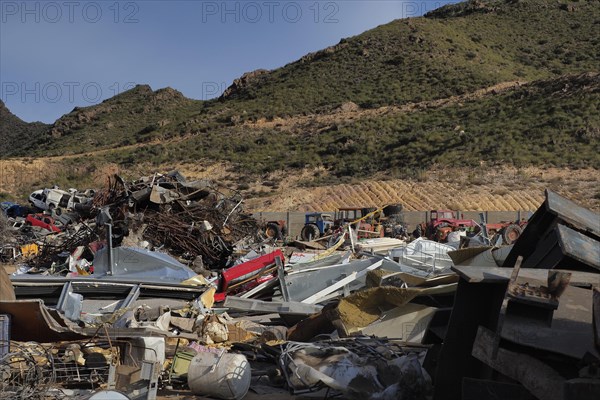 Scrap yard in hilly landscape