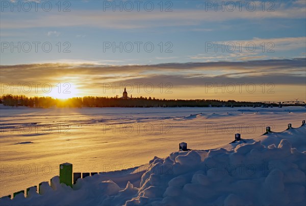 Sunrise over frozen Torneaelv