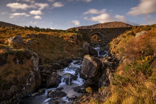 Mountain stream in autumn landscape