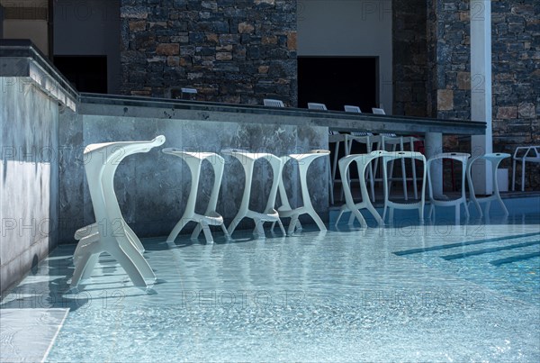 Bar and bar stools by the swimming pool