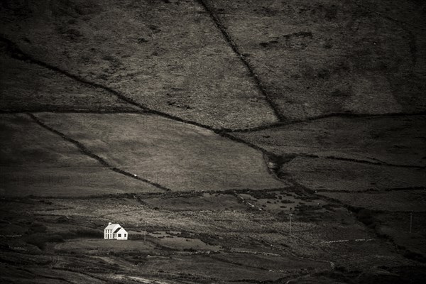 Small house in barren landscape