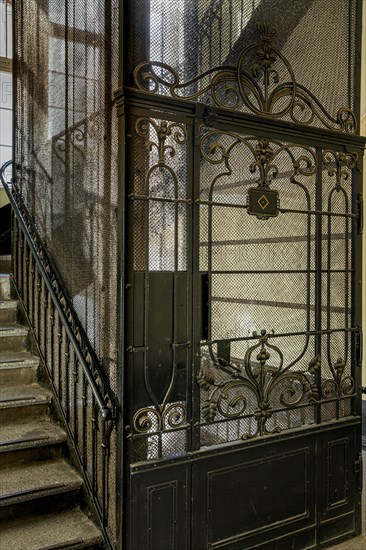 Ornate door from a historic lift in an old factory