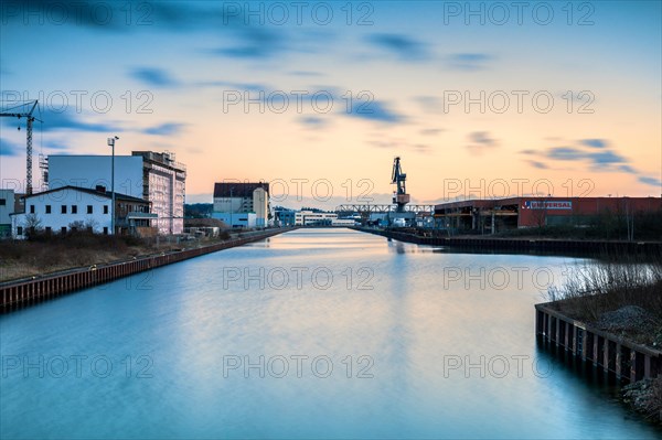 Long exposure at the canal in Hannover district Linden with view to the harbour at sunset