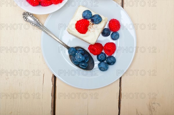 Fresh homemade raspberry and blueberry cream cake