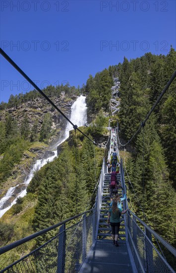 Hiking trail over a suspension bridge along the Stuibenfall near Umhausen