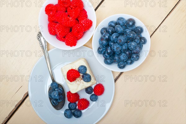 Fresh homemade raspberry and blueberry cream cake