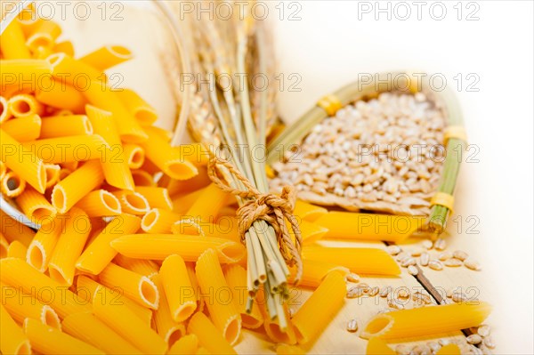 Short Italian pasta penne with durum wheat grains