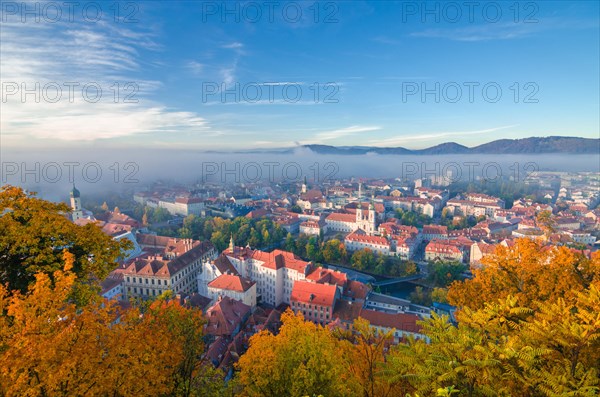 Cityscape of Graz with Mur river and Mariahilfer church