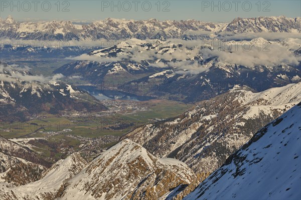 View from Mount Kitzsteinhorn on snow covered mountains down to Zell am See