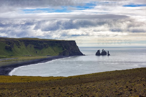 Bay with cliffs and black lava beach Reynisfjara