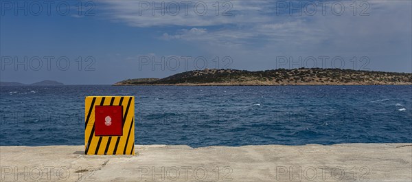 Yellow container for the fire hose at the harbour basin